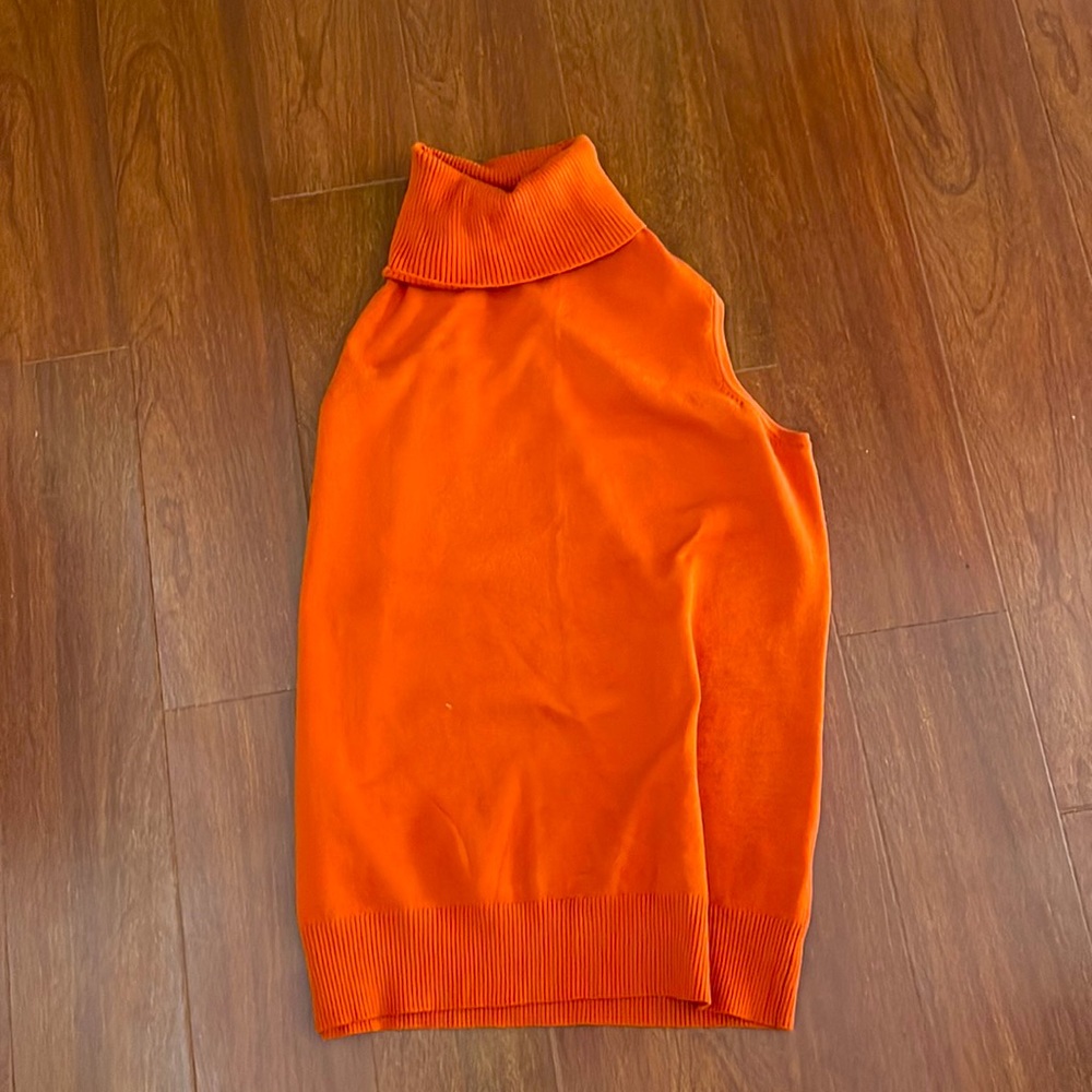 Orange sleeveless turtleneck